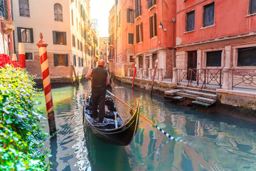Fototapeta na wymiar Venice, Italy. Scenic canal with gondola in Venice