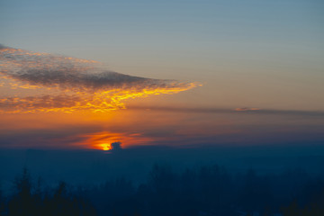 Sunny shine on clouds. Wonderful vivid dawn. Beautiful calm sunset. Scenic tranquil sunrise. Amazing peaceful cloudy sky. Sun above horizon. Picturesque sundown. Atmospheric cloudscape. Background.