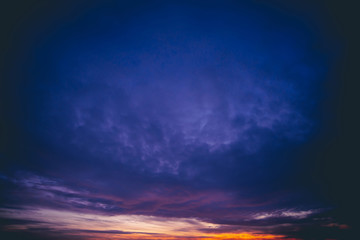 Amazing dramatic blue cloudy sky. Atmospheric minimalist background in overcast weather. Hard cloudiness. Storm clouds warning. Beautiful dark cloudscape. Sunset. Sunrise. Dawn. Copy space.