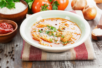 Traditional georgian soup kharcho in a plate on the table