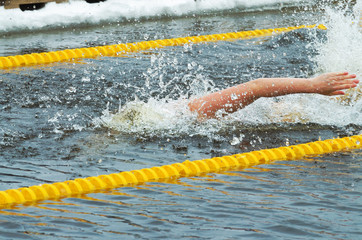 Lovers of winter swimming.Swimmer swims in the pool.