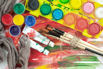 Paint brushes and paints for drawing.