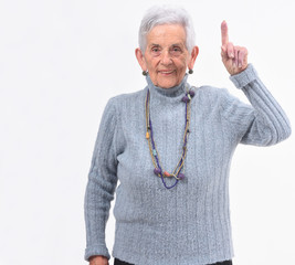 older woman with finger in the shape of number one