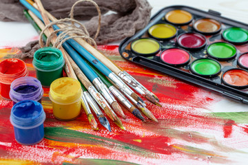 Paint brushes and paints for drawing.