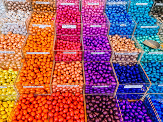 Multicolor store front or supermarket with Chocolate eggs in colorful foil for easter