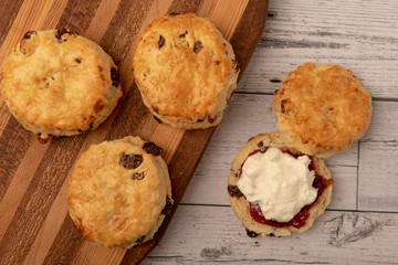 Fresh scones with cream and jam 