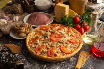 Meat pizza with pork and mushrooms