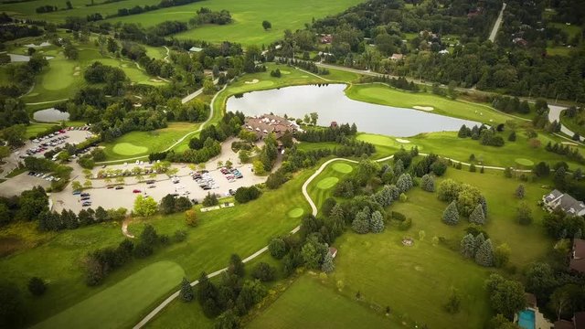 Beautiful aerial view across a large golf course surrounded by lush fields.