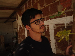 Young man of Arab descent wearing glasses