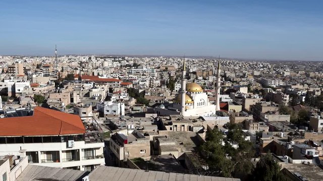Panoramic View of Madaba City with Many Houses And Blue Sky in the Background