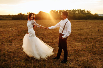 wedding couple with the sunset. romantic concept