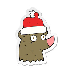 sticker of a cartoon bear wearing christmas hat