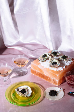 caviar on on the half shell with rose on pink velvet