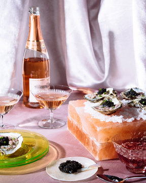 caviar on on the half shell with rose on pink velvet
