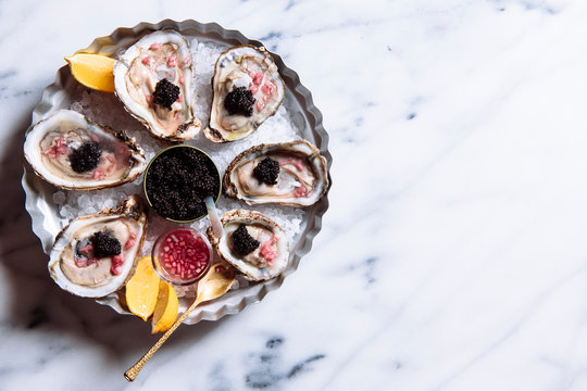 Close up of caviar on the half shell oyster