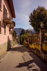 Fototapeta na wymiar Italy, Menaggio, Lake Como, a narrow street in front of a building