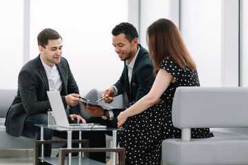 consultant discusses the terms of the contract with the young couple