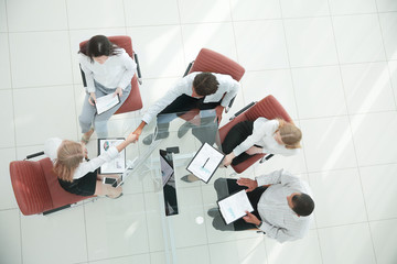 view from the top.the handshake business partners at the meeting.