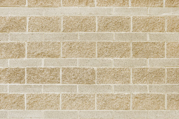 Old beige brick wall background texture