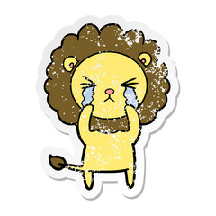 distressed sticker of a cartoon crying lion