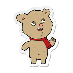 sticker of a cartoon teddy bear wearing scarf