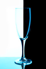 empty glasses for wine and champagne on a multicolored background vertical