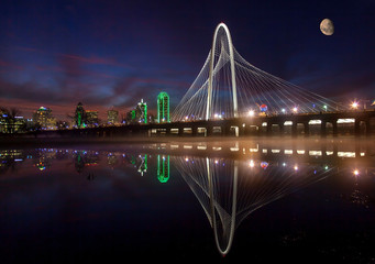 Dallas skyline and famous MHH bridge reflecting w/moon
