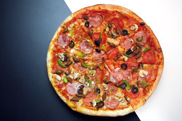 round bright pizza on white and black background