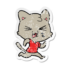 distressed sticker of a cartoon hissing cat