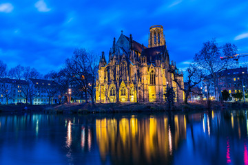 Germany, Famous church of st john in stuttgart feuersee reflecting in lake water