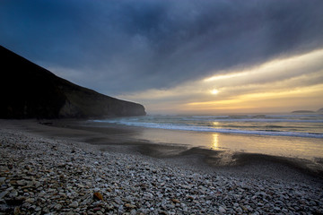 Colorful Sunset and moon in the sky  over  Beach in County Mayo Mulranny Ireland