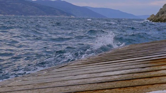 Detail of the agitated Adriatic sea in Brestova harbor. Croatia. Flat plane. Slow motion