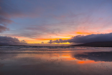 Fototapeta na wymiar Colorful Sunset and moon in the sky over Beach in County Mayo Mulranny Ireland