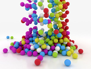 Falling multi colour balls on white background. 3D render