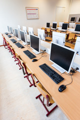 Computer lab with rows of computers in school