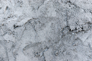 Background of gray casually superimposed concrete.