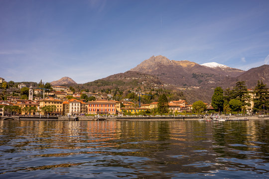 Italy, Menaggio, Lake Como, a body of water with a mountain in the background