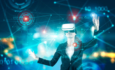 Businesswoman in VR goggles, binary code and hud