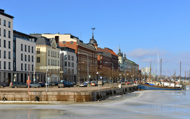 Fototapeta na wymiar Pohjoisranta embankment in sunny spring day. Helsinki, Finland