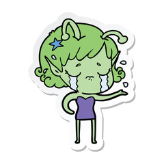 sticker of a cartoon crying alien girl