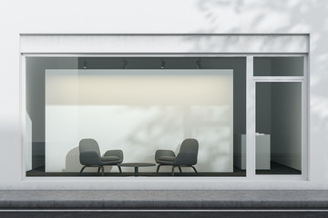 White office exterior with armchairs and poster