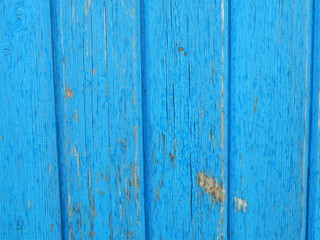 Grunge background. Peeling paint on an old wooden fence