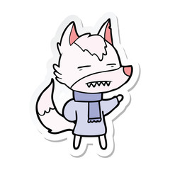 sticker of a cartoon wolf in winter clothes
