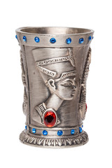Egyptian art. Close-up of egyptian metalic cup with gems isolated on a white background. Egypt souvenir. Macro.