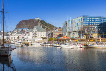 Fototapeta na wymiar Architecture of Alesund town reflected in the water, Norway