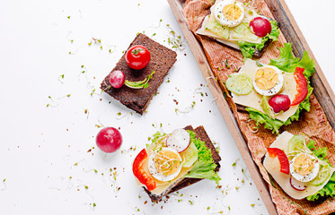 Dietary sandwiches. Dark bread, salads, eggs, cheese and tomatoes