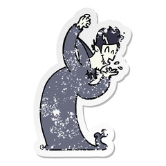 distressed sticker of a cartoon vampire