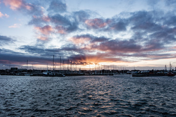 Obraz premium Sun setting over one of Copenhagen's many harbors