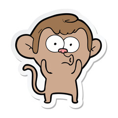 sticker of a cartoon hooting monkey