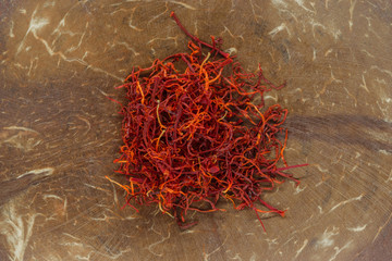 Saffron on natural coconut brown bowl background